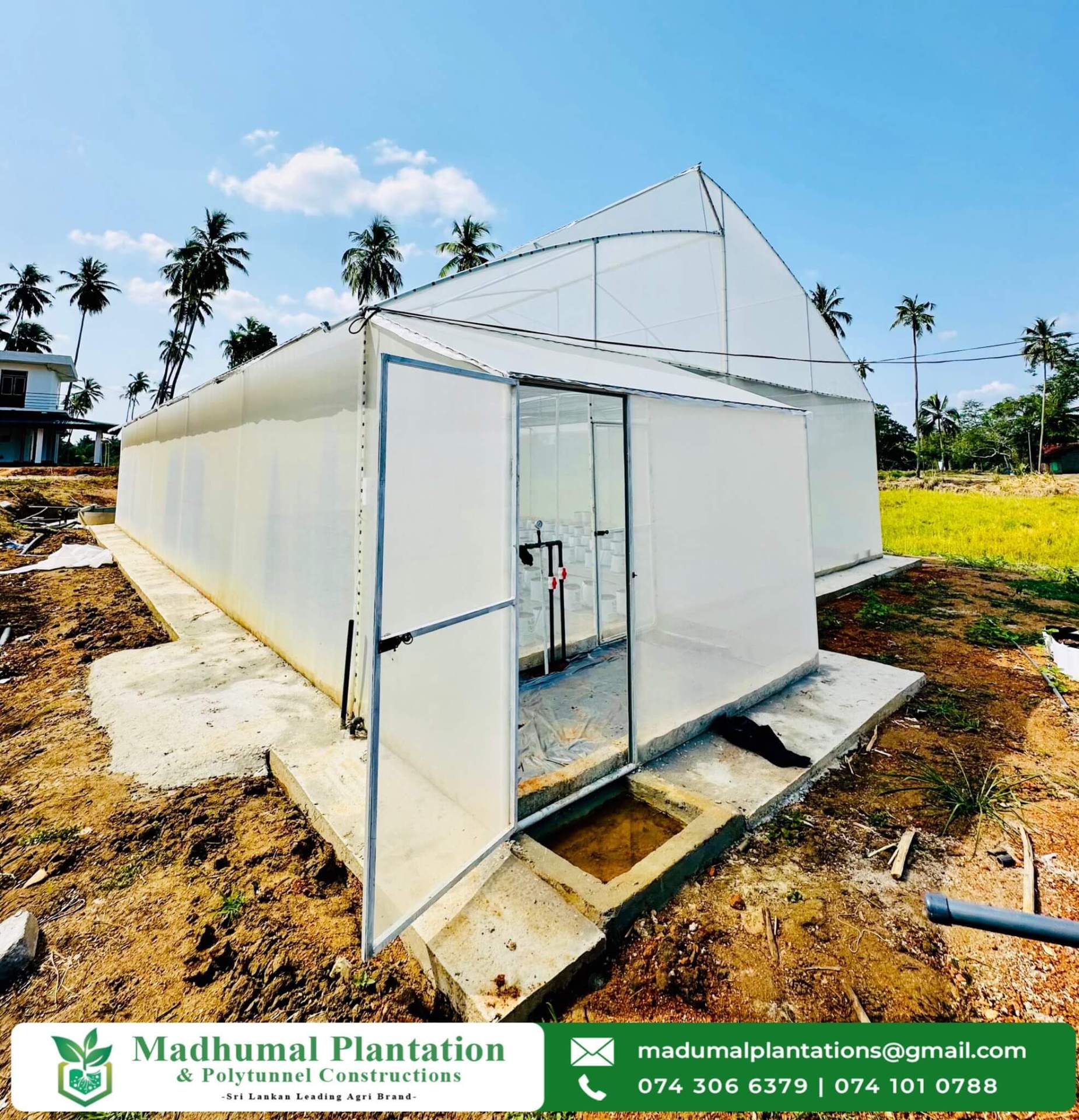 Newly completed polytunnel with entrance door and concrete base